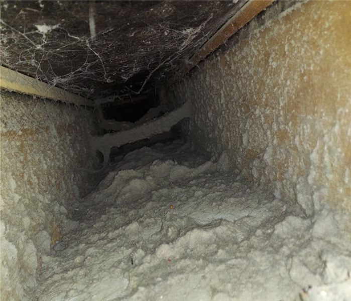 HVAC duct filled with dirt