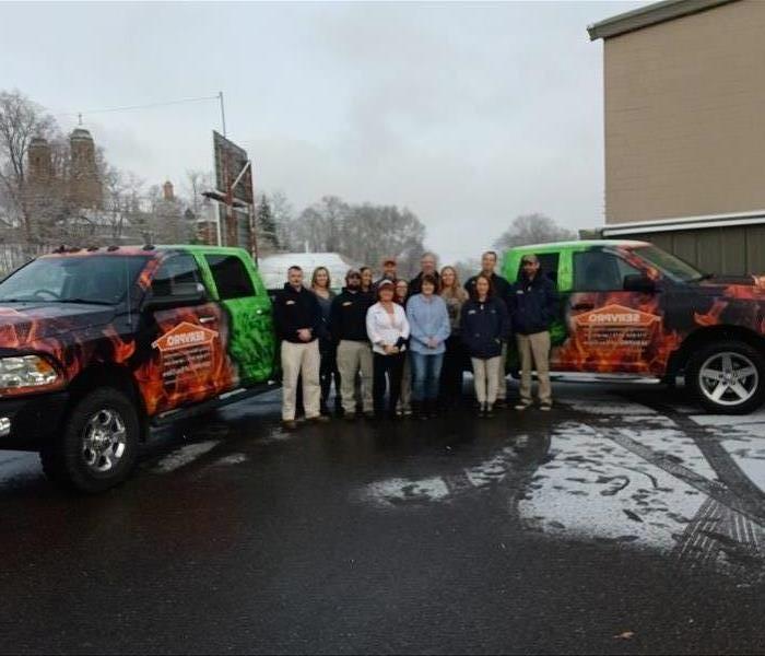 Green Trucks with Employees