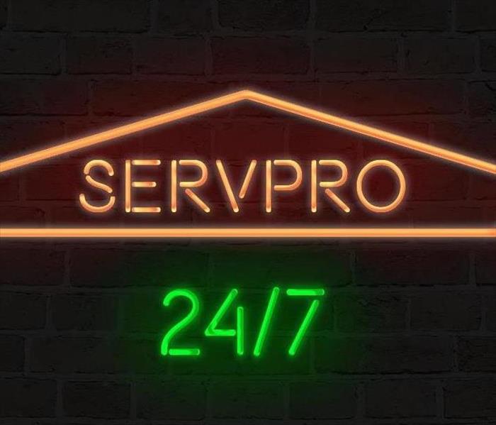 SERVPRO logo in neon lights with 24/7